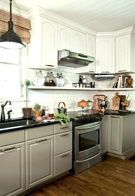 shelves under kitchen cabinets any other suggestion since replacing with a freestanding hood easy because it cant be squeezed in the space over the range between the cabinets build storage above kitch