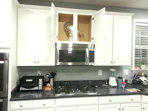 kitchen cabinets above microwave cabinet above my microwave a wine rack are there any suggestions on a design to hide the ugly vent pipe and build a rack insert inside the cabinet kitchen cabinet micr