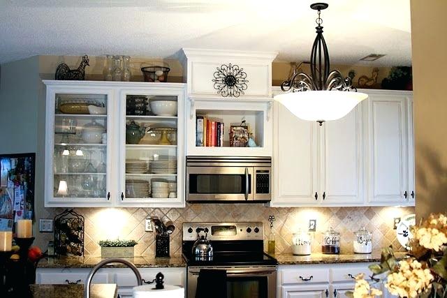 kitchen cabinets above microwave considering removing the cupboard above my stove and putting a microwave range kitchen cabinets microwave placement